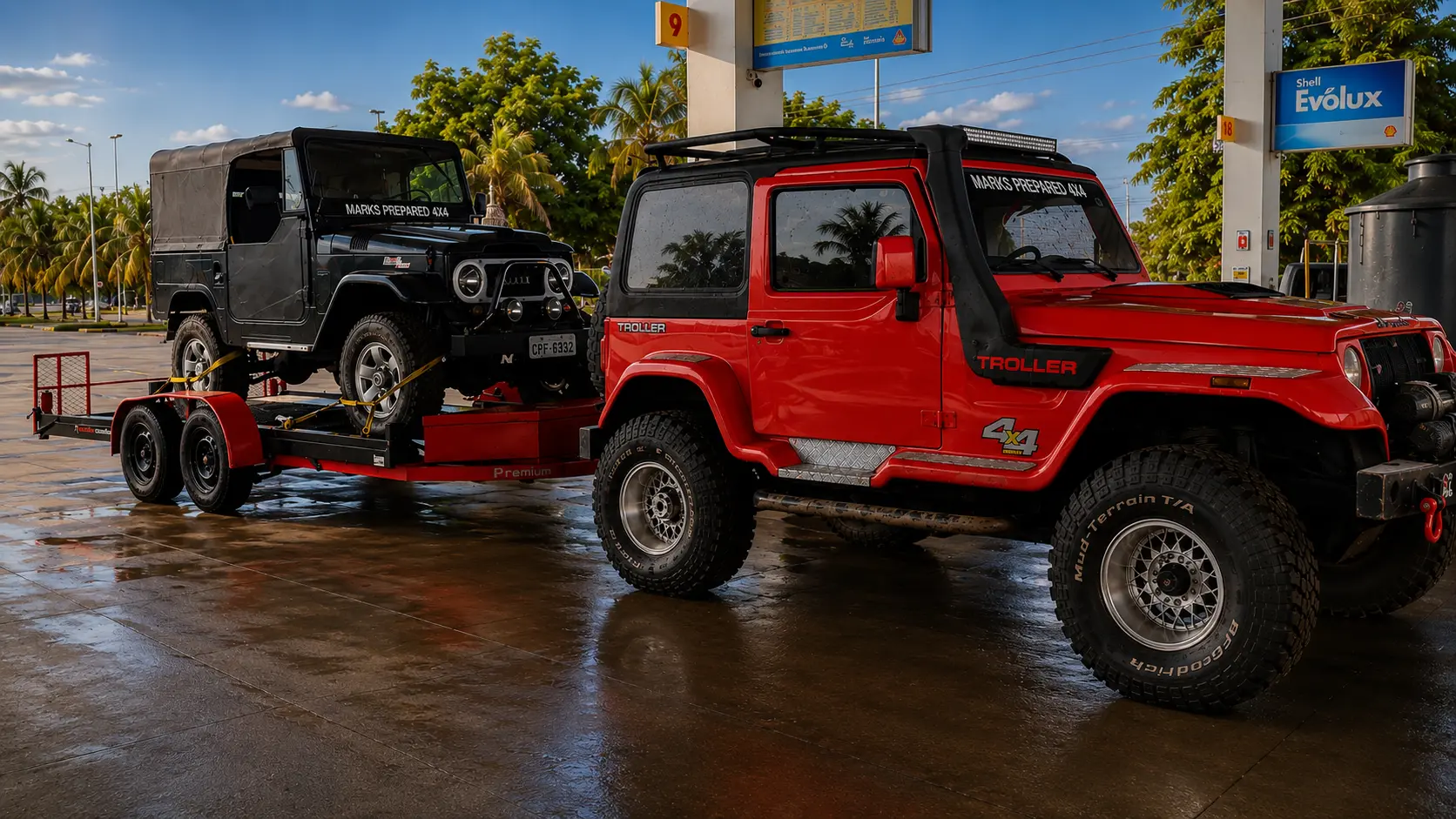 Troller vermelho rebocando Jeep Willys preto em prancha