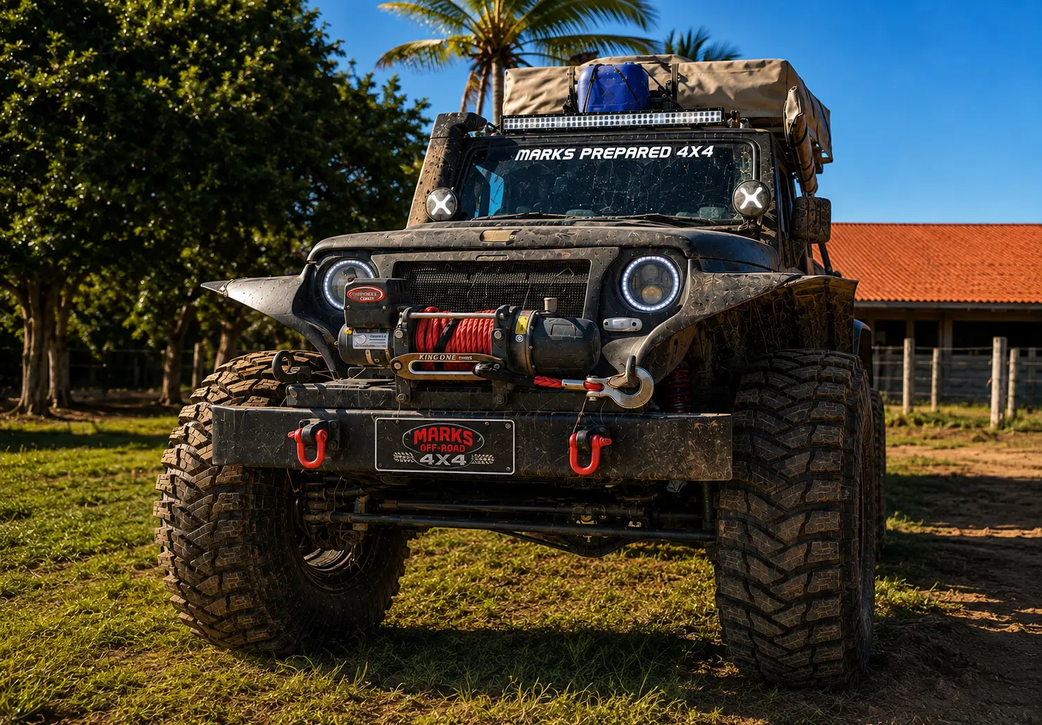 Jeep Wrangler preparado com guincho, pneus extremos e barraca de teto